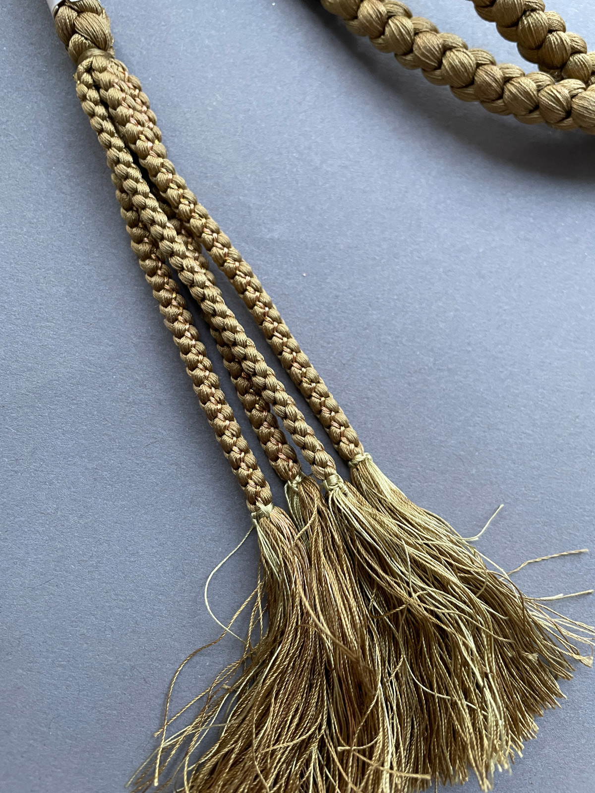 Silk obijime cord in olive-gold with green beads