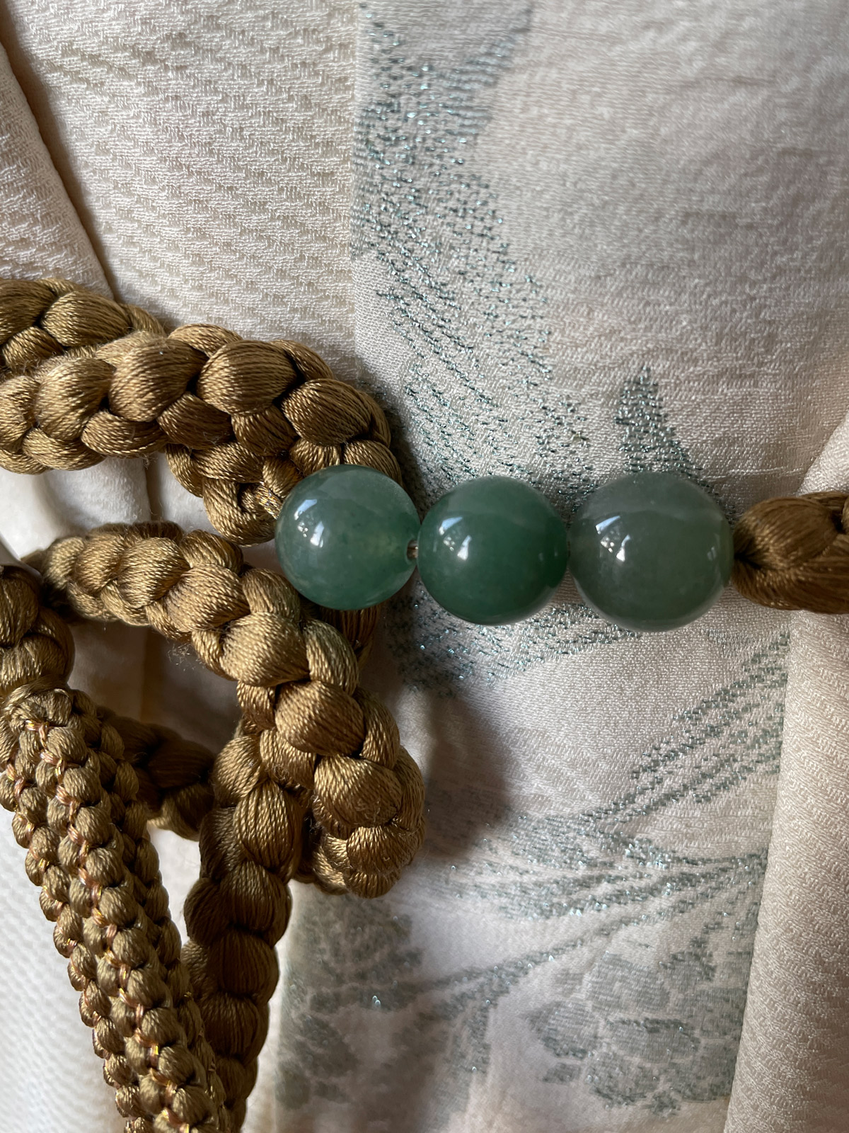 Silk obijime cord in olive-gold with green beads