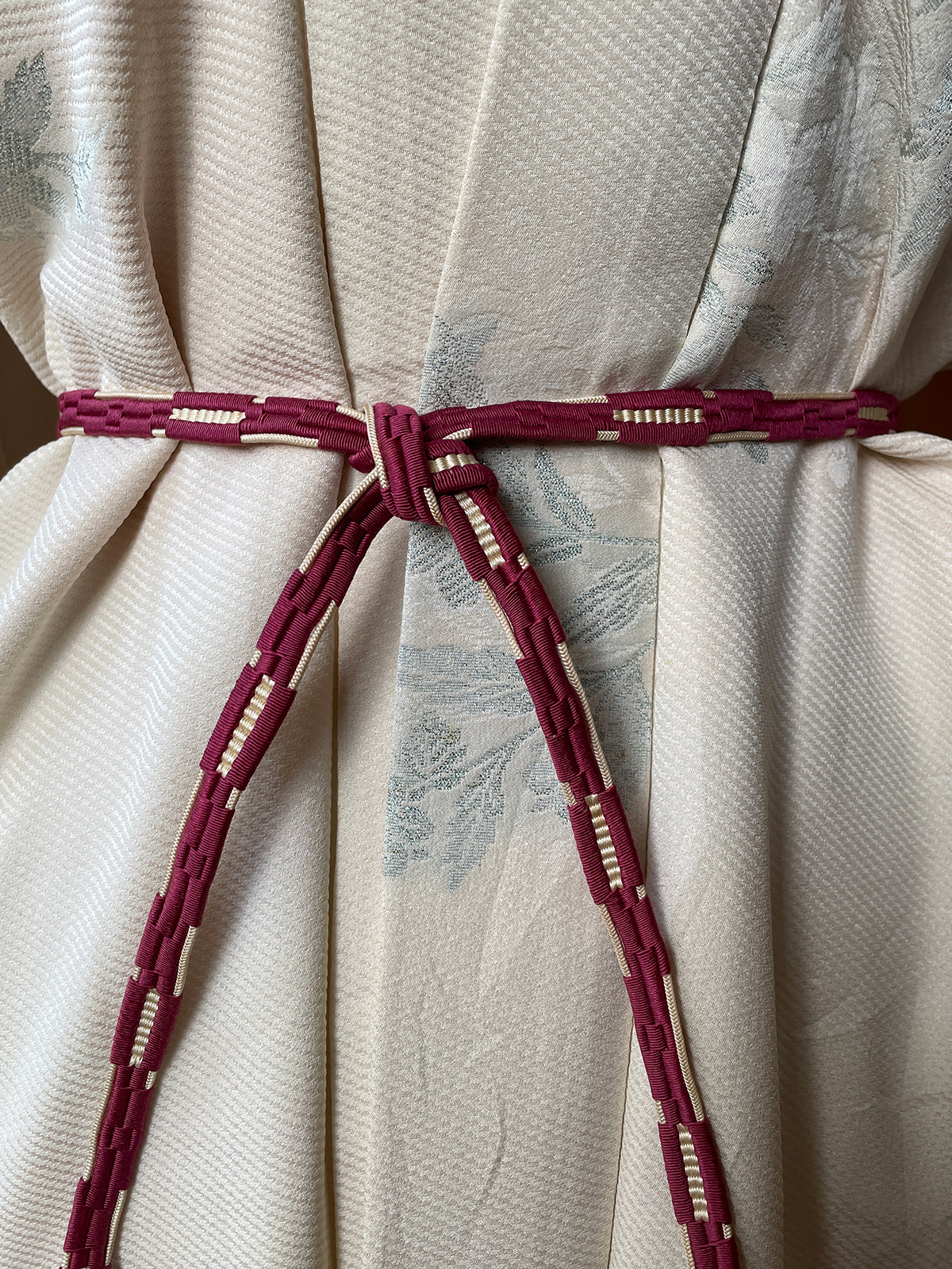 Cleverly woven silk obijime cord in wine red and beige