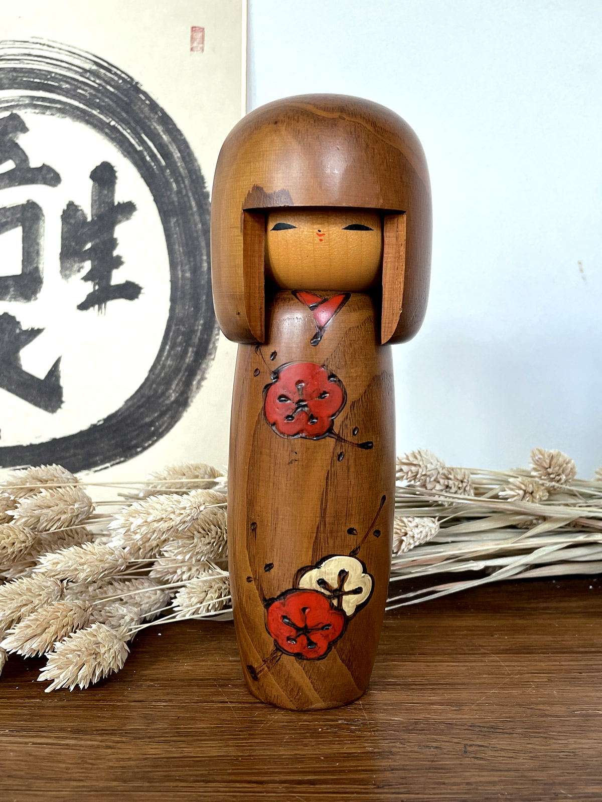 Vintage chestnut wooden kokeshi by Usaburo