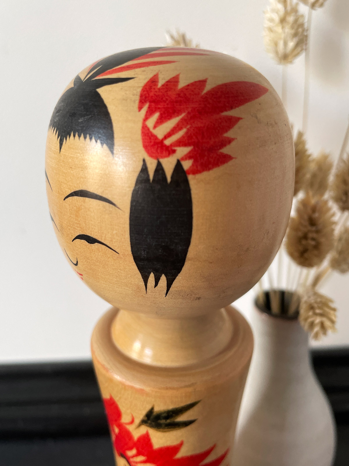 Traditional wooden Kokeshi doll in Narugo style