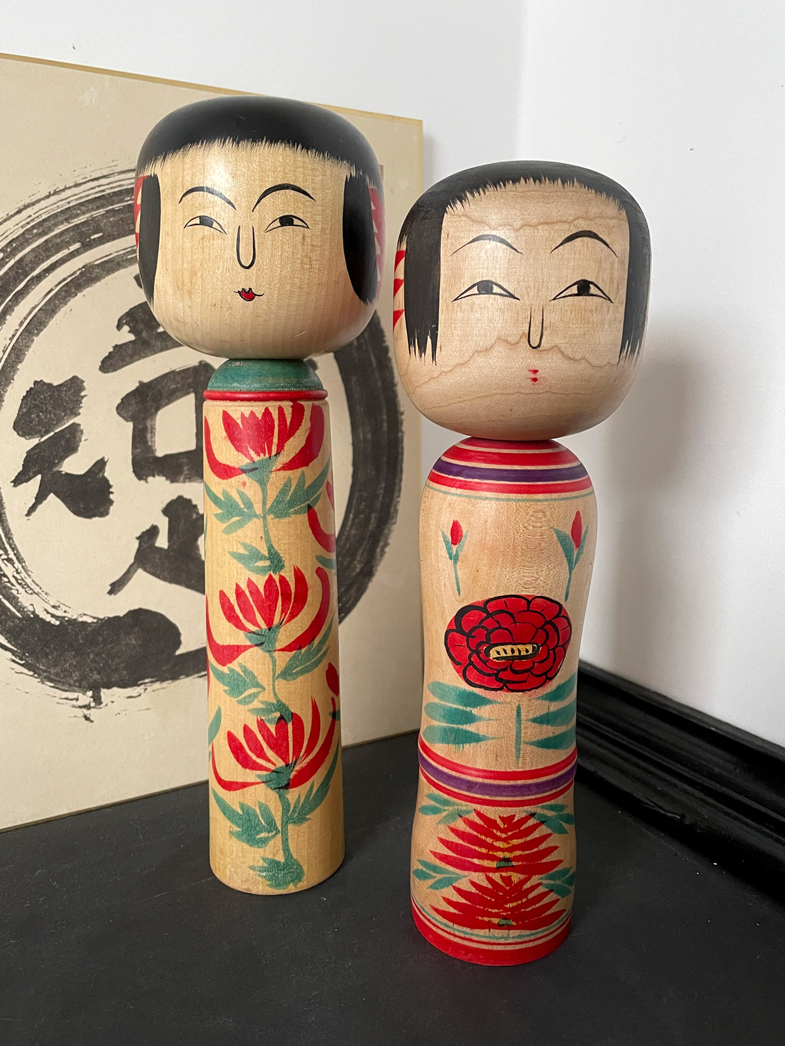 Traditional Kokeshi set with bright colored flower design