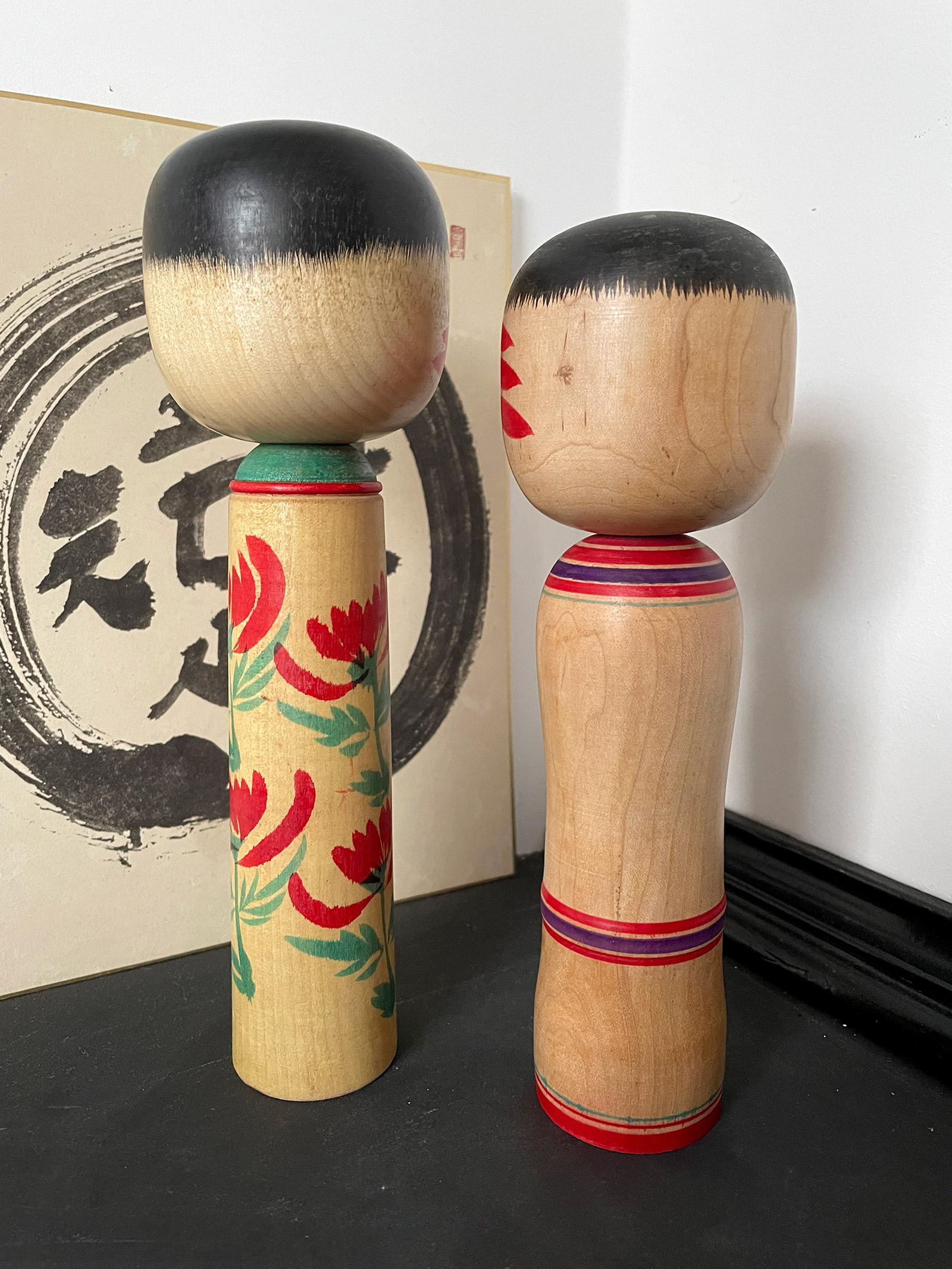 Traditional Kokeshi set with bright colored flower design
