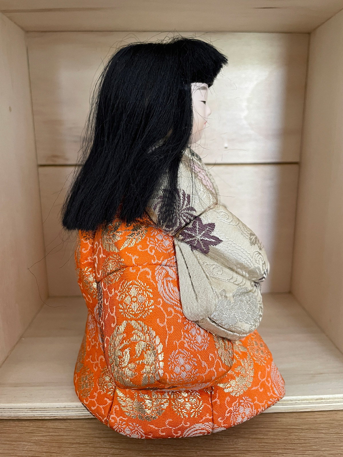 Vintage Kimekomi doll wearing beautifully decorated Kimono