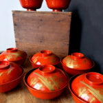 Antique red Urushi lacquerware bowls with gold hand-painted design
